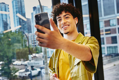Man smiling at laptop