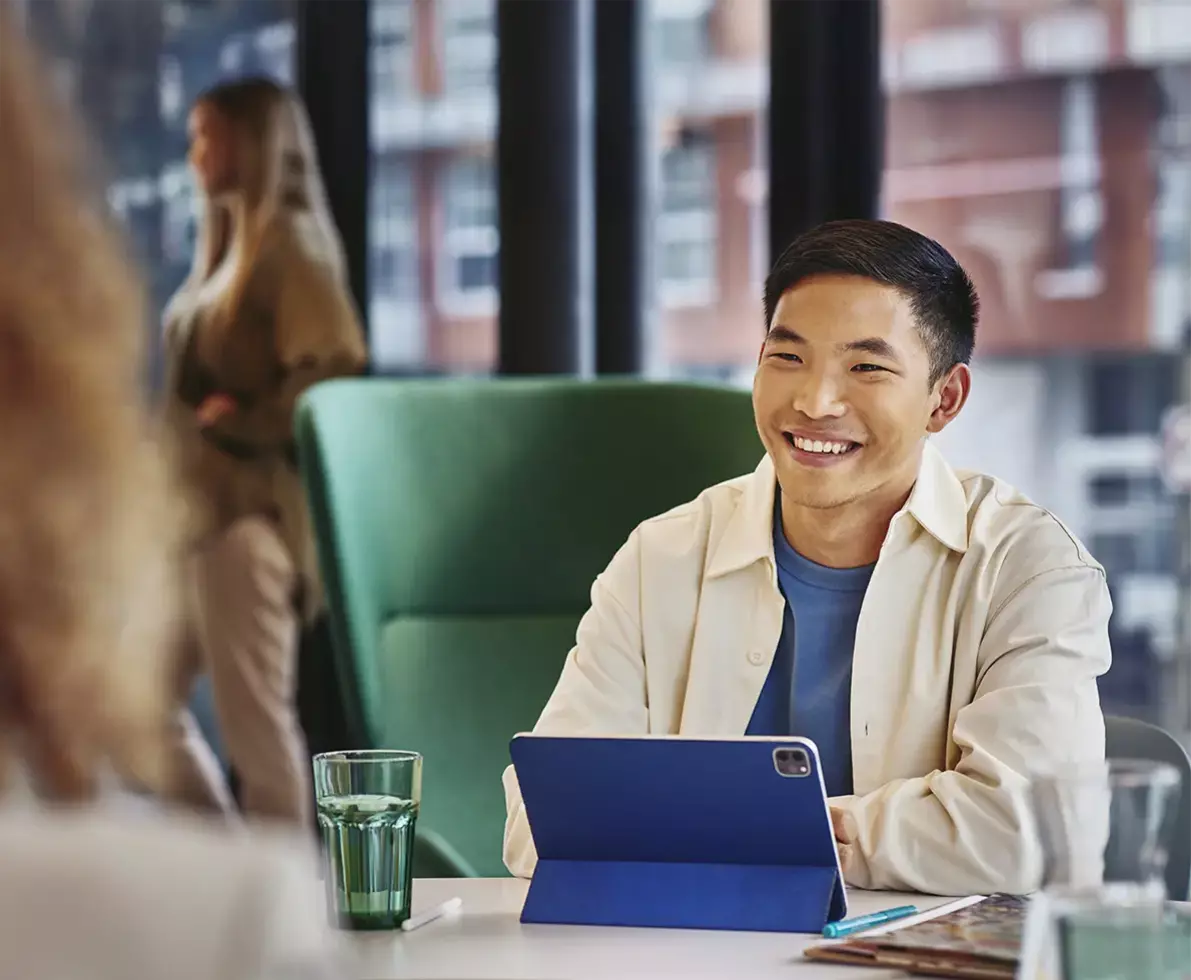 Person with tablet in office